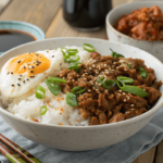 Korean-Style Ground Turkey served over rice with sesame seeds and green onions.